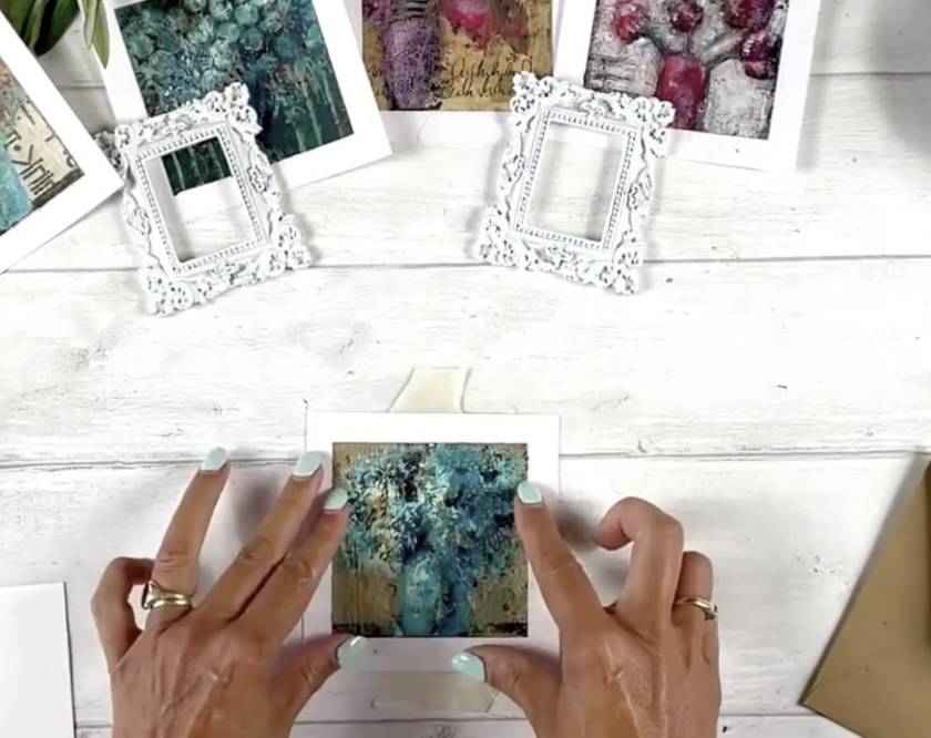 Finished mini-flower paintings in Marina's hands